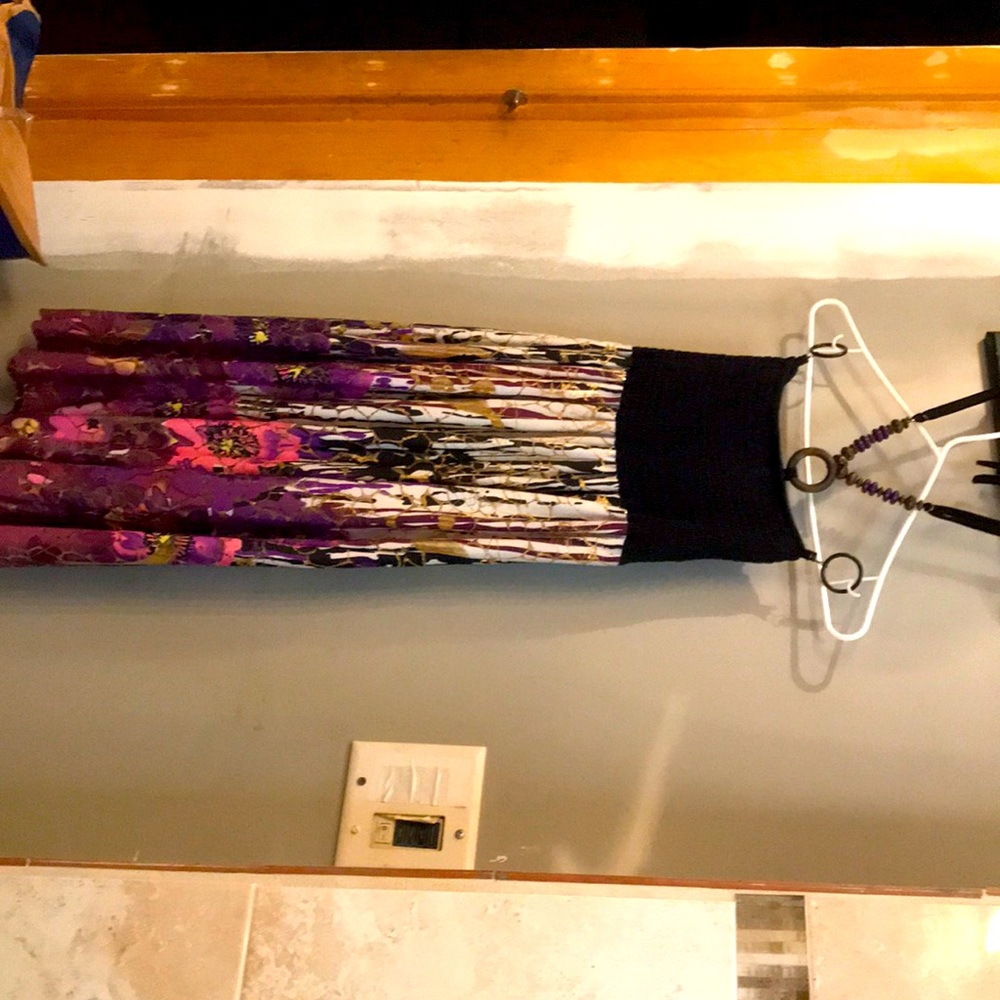 Stunning sundress that flows in the wind material is like silk against your skin